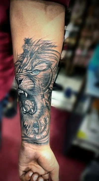 lion tattoo on forearm