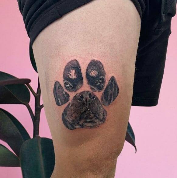 dog paw print tattoo on leg