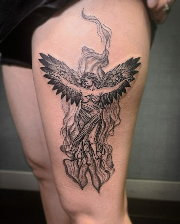 angel tattoo on thigh