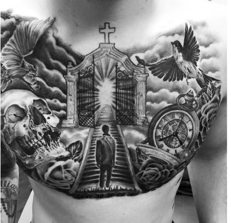 A man waiting on stairway to heaven tattoo with bird, cross, skull and clock