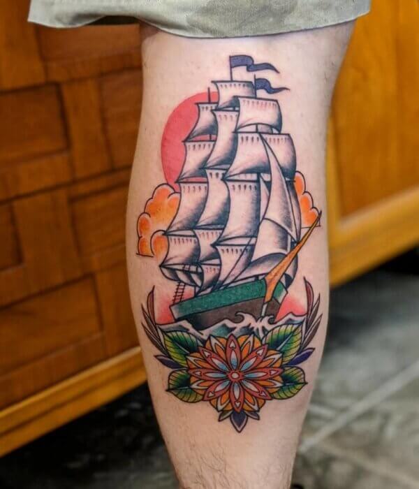 Bright Ship Tattoo On Calf